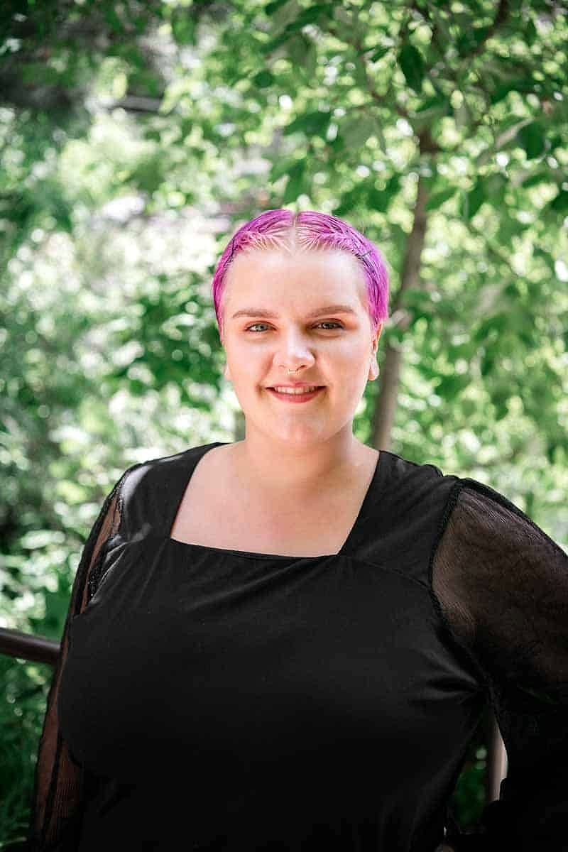 A Salon Sister with pink and blonde hair